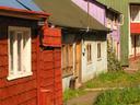 Another row of colorful, riverside homes.